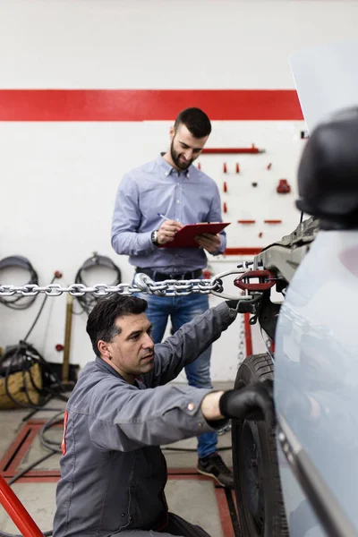 Auto Mechanics Repairing Car — стоковое фото